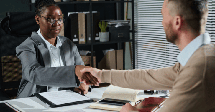 Couple signing house purchase paperwork