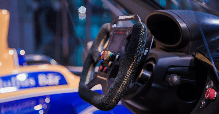 Close-up of dials and paddles on a race steering wheel