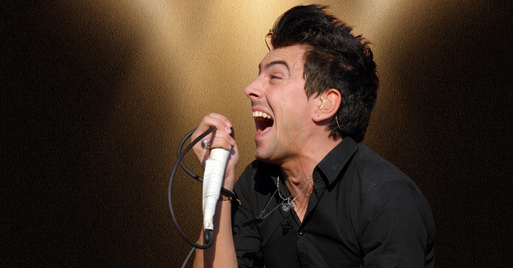 Microphone standing on a dimly lit stage